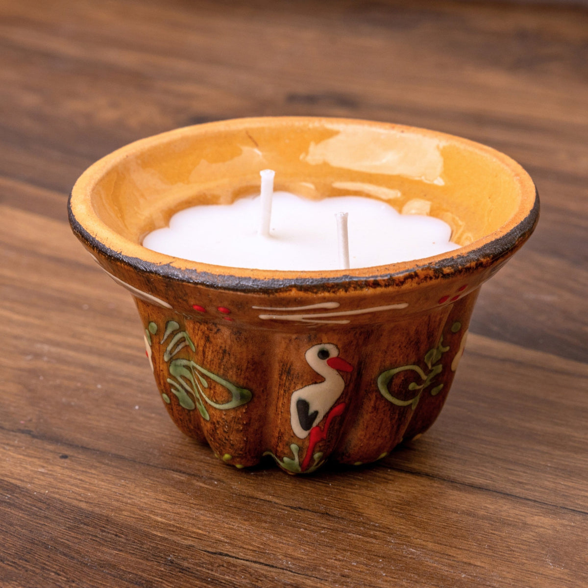 Bougie kougelhopf motif cigogne marron en poterie de Soufflenheim, La Bougiterie