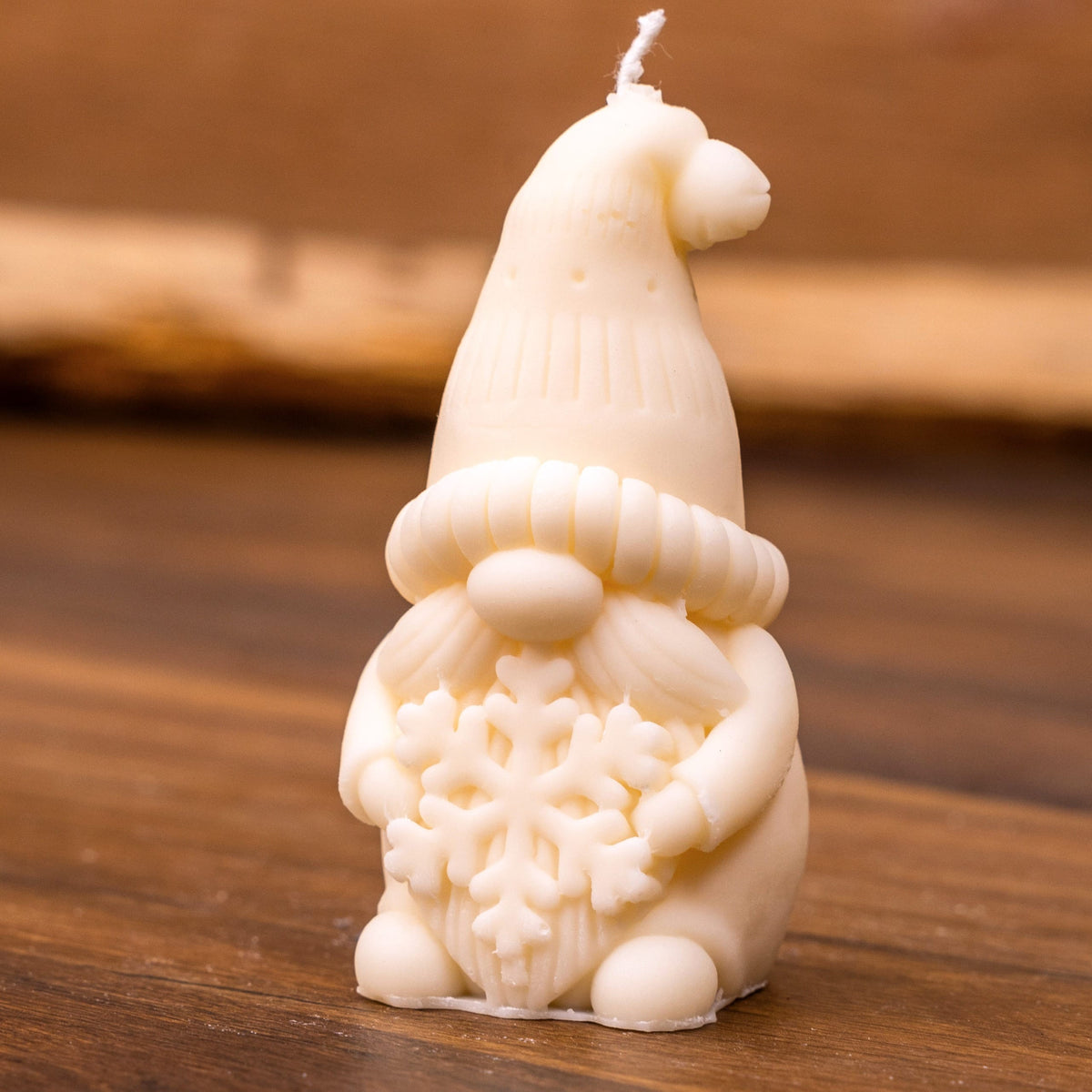 Bougie lutin de Noël flocon – gnome tenant un flocon de neige