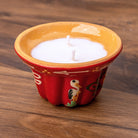 Bougie kougelhopf motif cigogne rouge en poterie de Soufflenheim, La Bougiterie