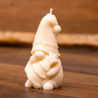 Bougie lutin de Noël sapin – gnome portant un petit sapin